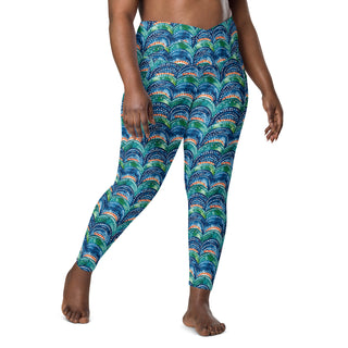 Stretchy crossover leggings for fluid yoga flow, balance, and breathe - styled in bold blue rainbows