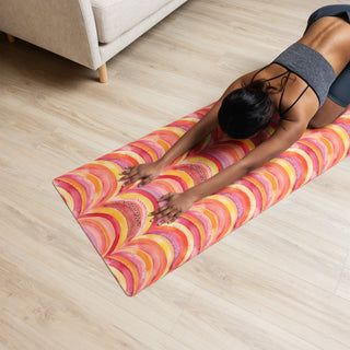 Yoga mat with pink-orange rainbows pattern - cushioned, tactile, and made for smooth, comfortable movement