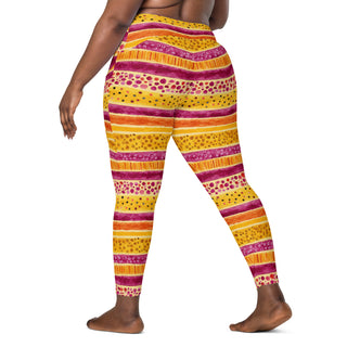 Crossover leggings built for gym sets and running stride - styled with bold pink-yellow stripes for powered energy