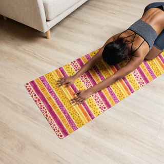 Yoga mat with pink-yellow stripes pattern - cushioned, tactile, and made for smooth, comfortable movement